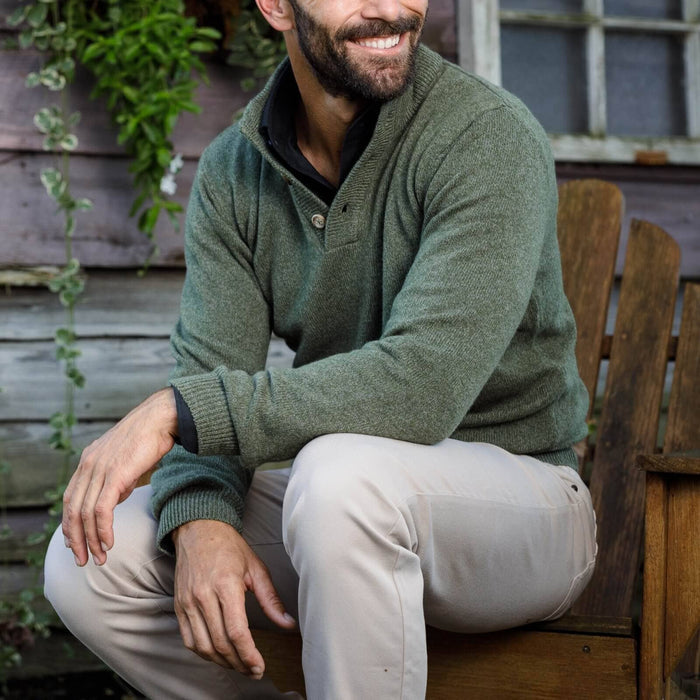 Sage Brewer Mock Neck Sweater styled outdoors, three-button mock collar detail visible