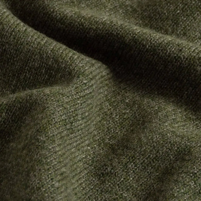 Close-up of sage green superfine merino wool knit texture on the Brewer Mock Neck Sweater