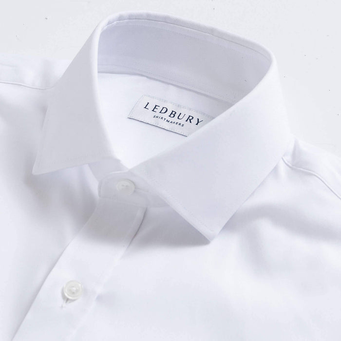 White Canon dress shirt collar detail - premium performance fabric construction