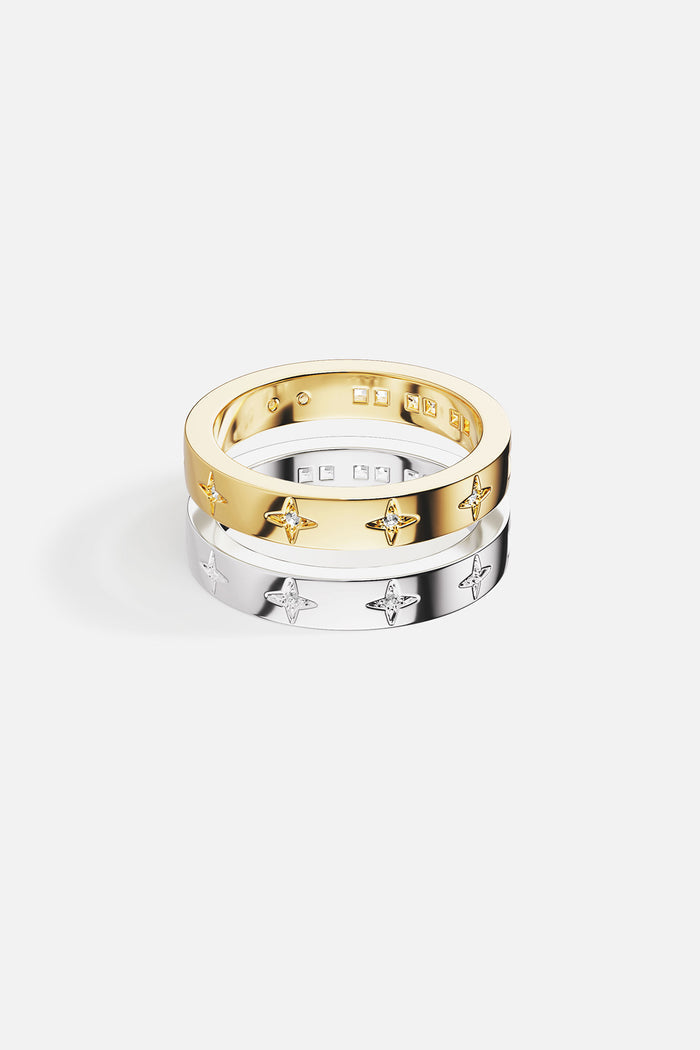APM Rings, a starlit duo in golden and rhodium finish, effortlessly celestial.