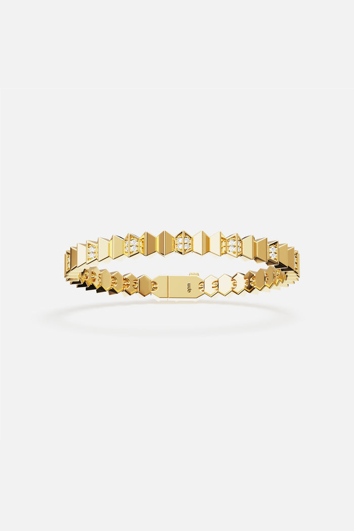 APM bracelet in golden hues, faceted geometry meets modern edge.