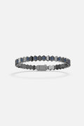 APM Bracelet in rhodium finish, geometric edge with deep blue sparkle.