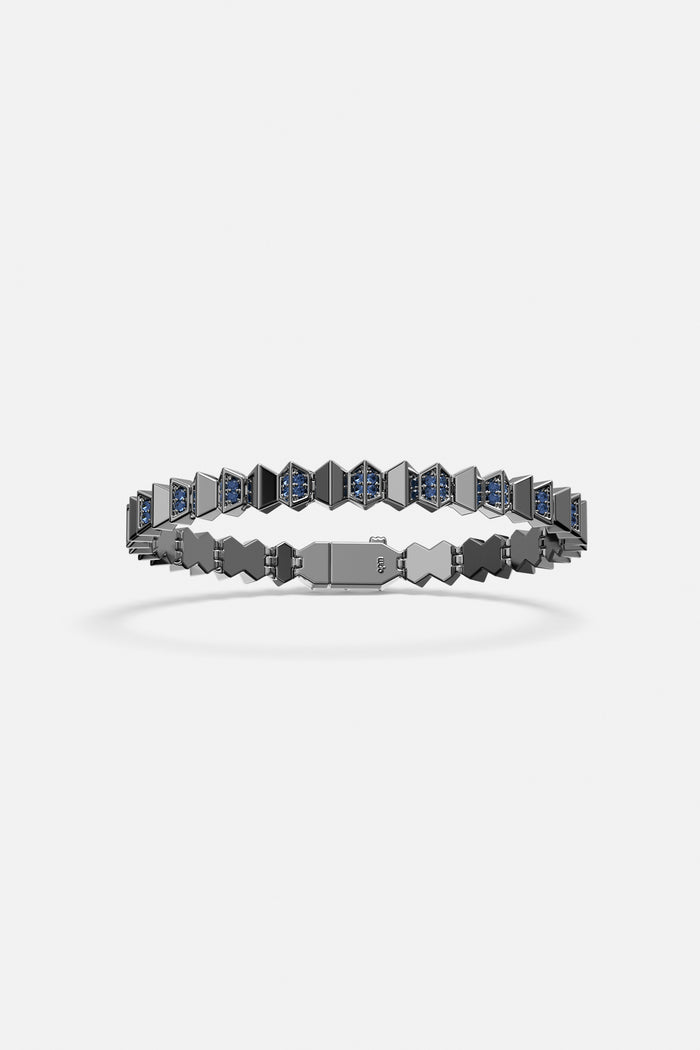 APM Bracelet in rhodium finish, geometric edge with deep blue sparkle.
