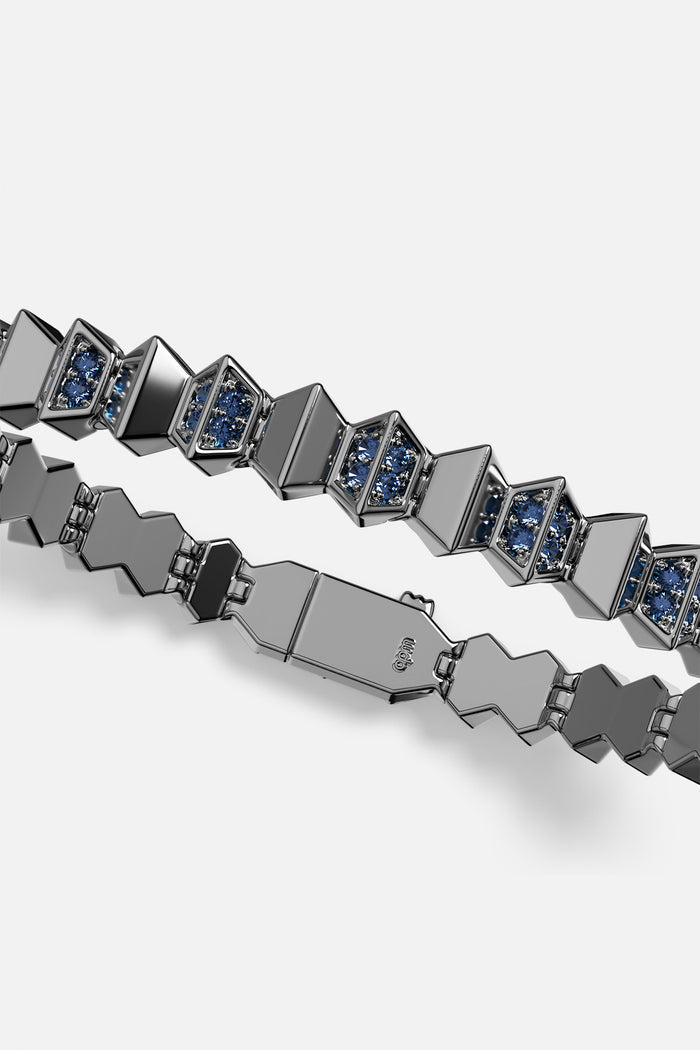 APM Bracelet in dark rhodium finish, faceted links glowing with deep blue brilliance.