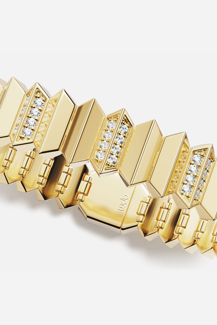 APM Bracelet in golden color, sculpted links glimmering with modern edge.