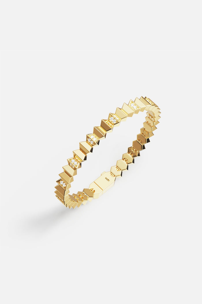 APM Bracelet in golden hues, sculpted geometry meets quiet radiance.