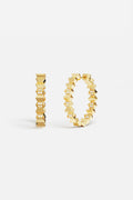 APM Hoop Earrings, bold golden edges with a sparkling modern edge.