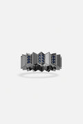 APM Ring, sculpted architecture with deep blue accents, boldly modern.